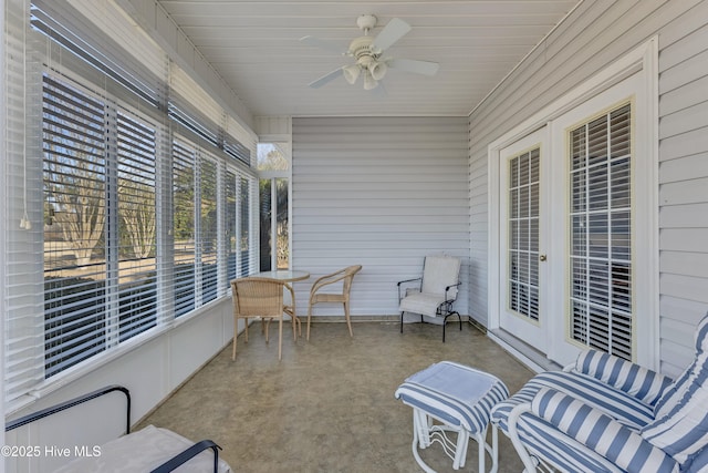 sunroom / solarium featuring ceiling fan