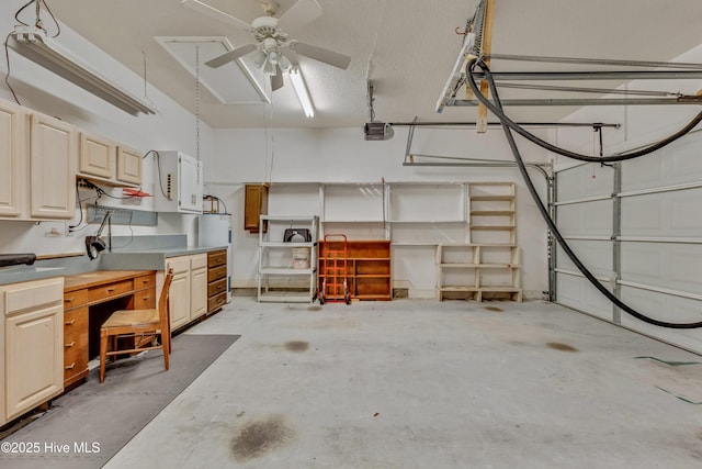 garage featuring a garage door opener and electric water heater