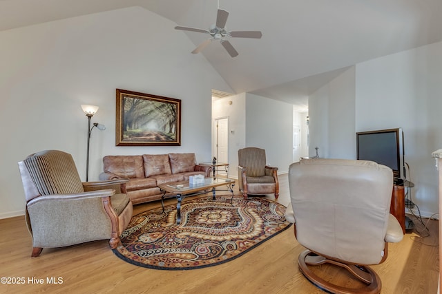 living room with ceiling fan, wood-type flooring, and high vaulted ceiling