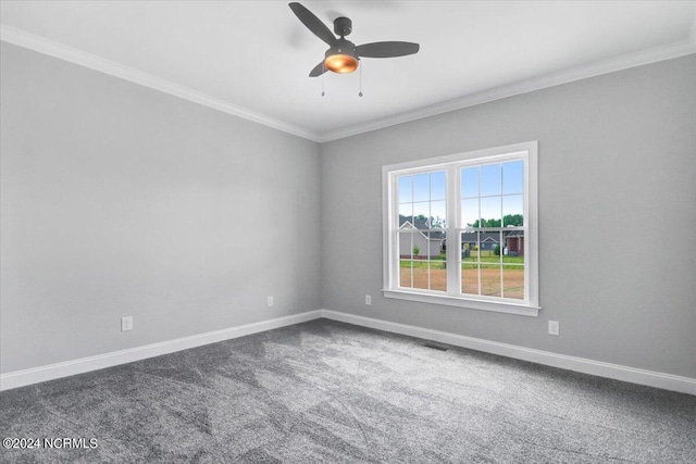 empty room with crown molding, carpet flooring, and ceiling fan