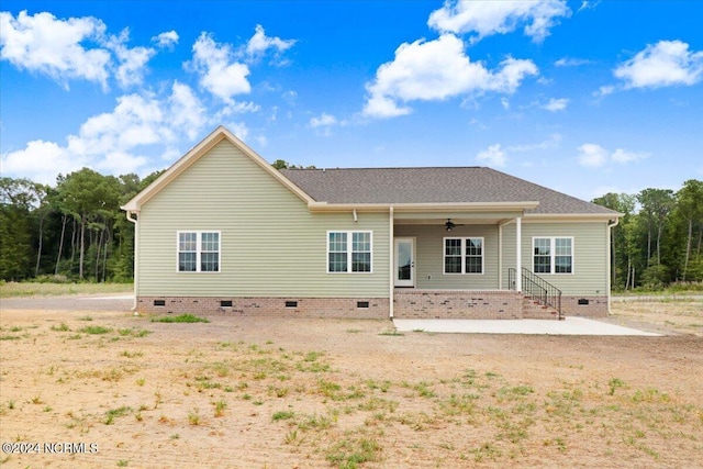 back of property with a porch and a patio