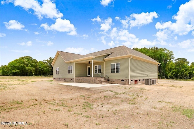 view of front facade featuring central AC unit and a patio area