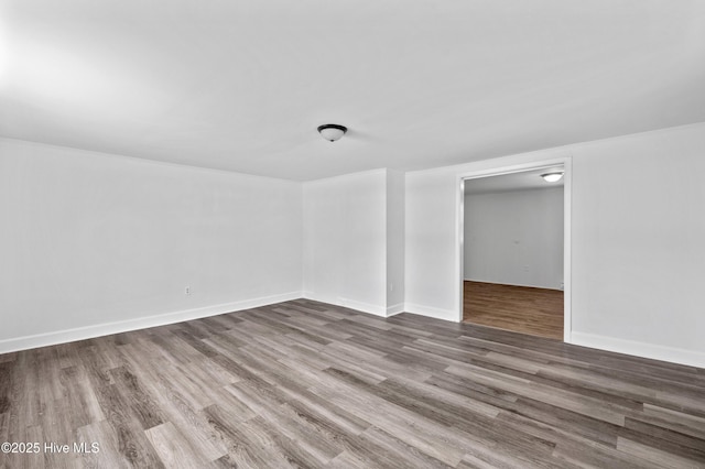 spare room with hardwood / wood-style flooring