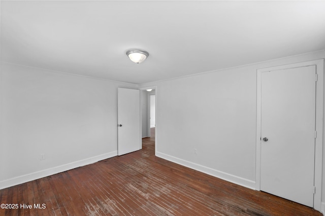 spare room featuring dark hardwood / wood-style floors