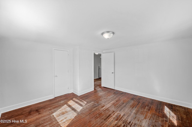 empty room featuring wood-type flooring