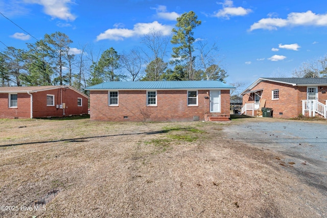 rear view of house featuring a yard