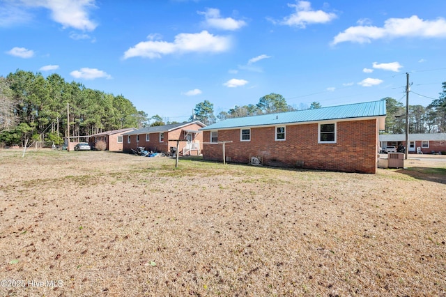 back of house with a yard