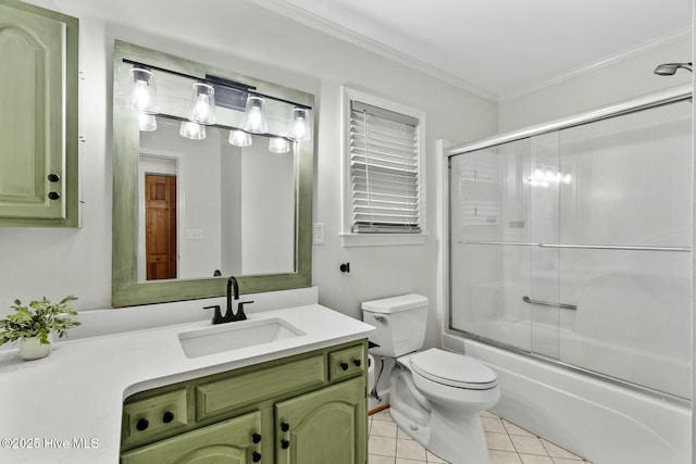 full bathroom with shower / bath combination with glass door, tile patterned flooring, vanity, ornamental molding, and toilet