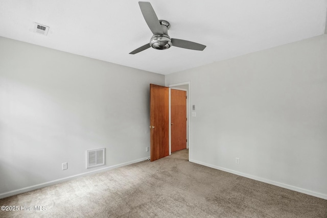 unfurnished room featuring light carpet and ceiling fan