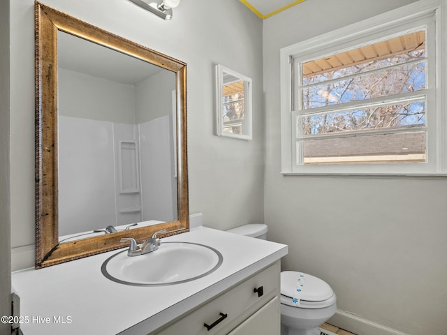 bathroom featuring vanity and toilet