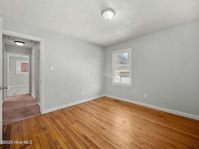 unfurnished room featuring hardwood / wood-style flooring