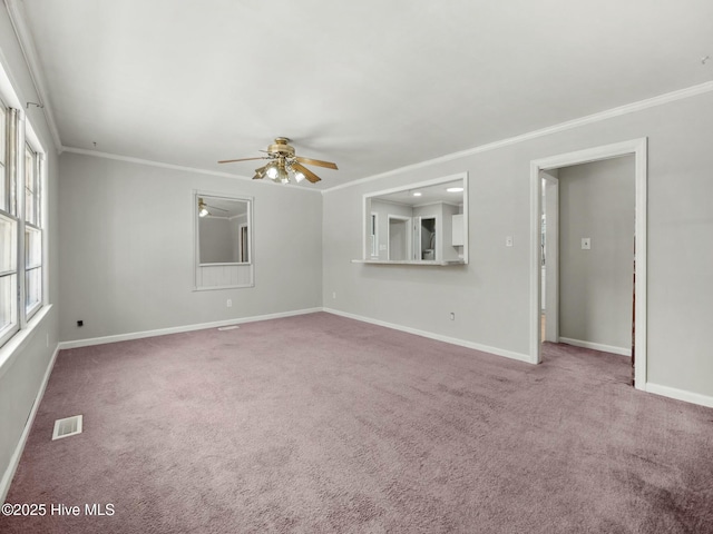 unfurnished living room featuring ornamental molding, ceiling fan, and carpet