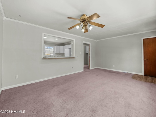 unfurnished living room featuring light carpet, ornamental molding, and ceiling fan