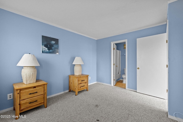 carpeted bedroom with ensuite bathroom