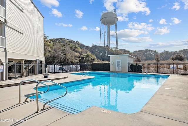 view of swimming pool featuring a patio area