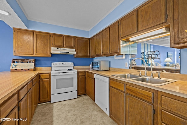 kitchen with sink and white appliances