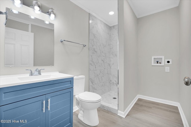 full bath featuring baseboards, vanity, toilet, and wood finished floors