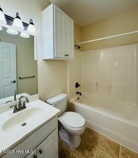 full bathroom featuring tile patterned flooring, shower / washtub combination, vanity, and toilet