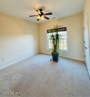 spare room with ceiling fan