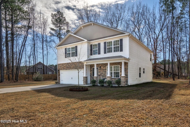 craftsman house featuring an attached garage, stone siding, a front yard, and driveway