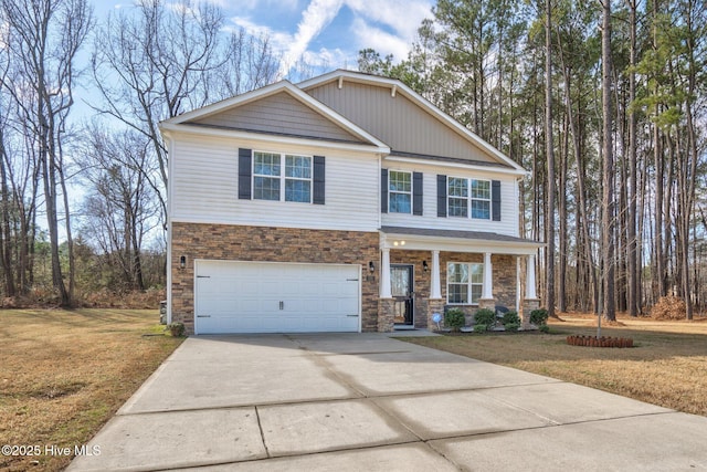 craftsman inspired home with a front yard, stone siding, driveway, and an attached garage