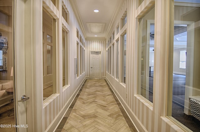 hallway featuring baseboards, ornamental molding, and recessed lighting