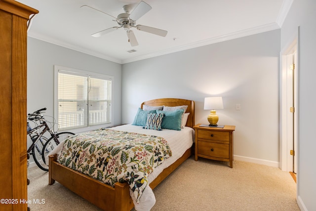 carpeted bedroom featuring crown molding and ceiling fan