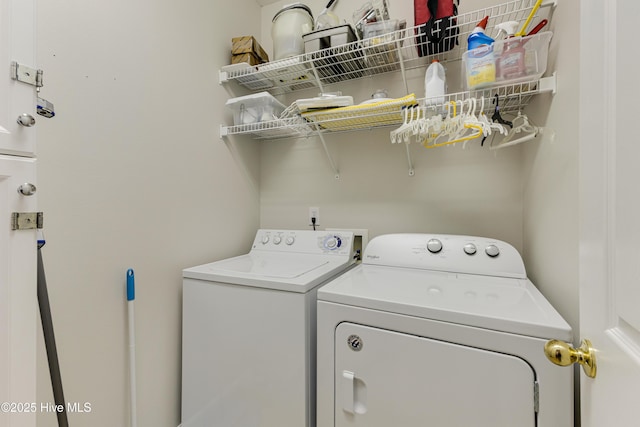 washroom with washing machine and dryer