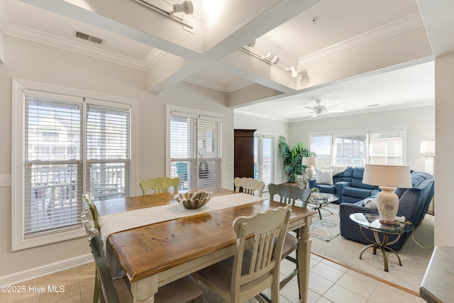 tiled dining room featuring crown molding and ceiling fan