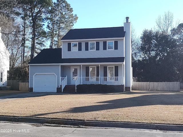 view of front of property featuring a garage and covered porch