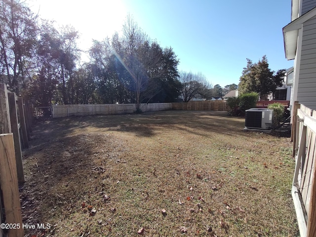 view of yard with central air condition unit