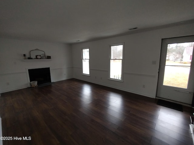 unfurnished living room with dark wood-type flooring