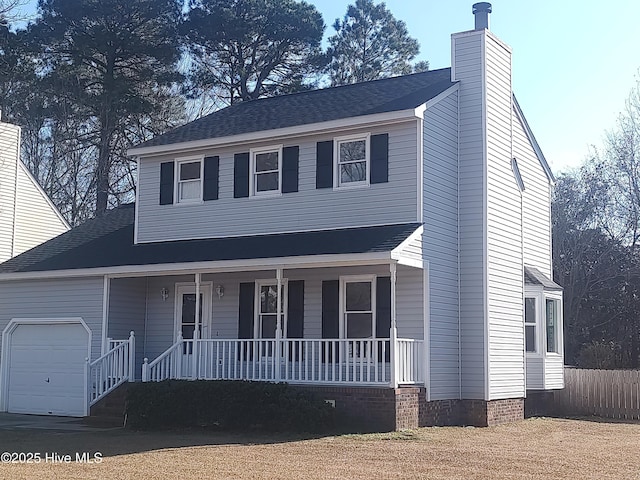 view of front of home featuring a garage and covered porch