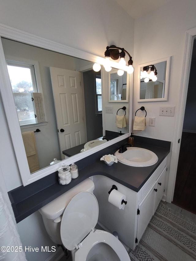 bathroom with vanity and toilet