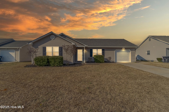 single story home with a yard and a garage