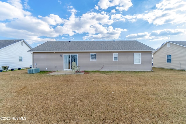 back of property with cooling unit, a yard, and a patio