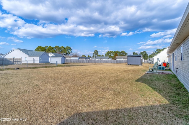 view of yard featuring a storage unit