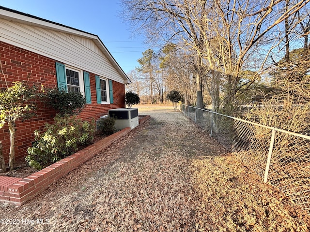 view of yard with central AC unit