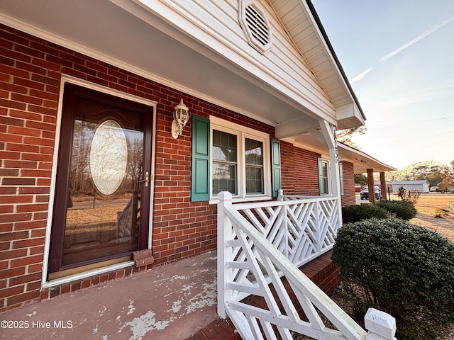 doorway to property with covered porch