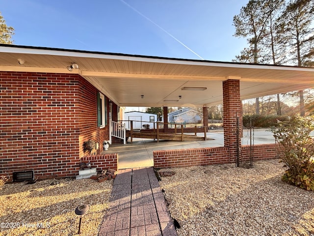 view of patio / terrace featuring a carport