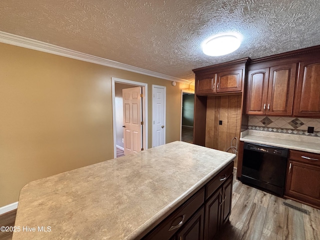 kitchen with dishwasher, backsplash, ornamental molding, a textured ceiling, and light wood-type flooring