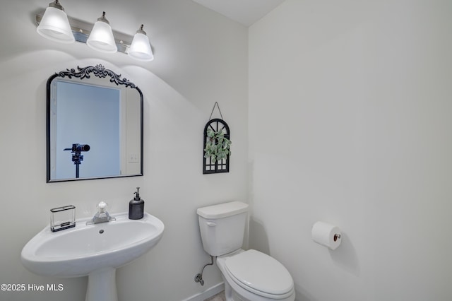 bathroom with toilet and sink