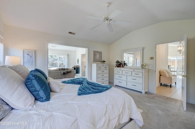 bedroom featuring ceiling fan, lofted ceiling, and light carpet