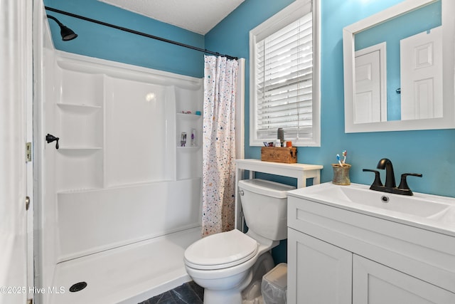 bathroom featuring vanity, toilet, a textured ceiling, and a shower with shower curtain