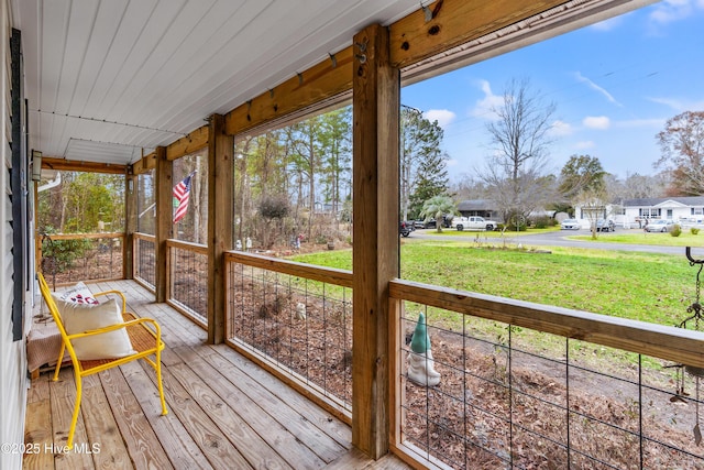 unfurnished sunroom featuring wood ceiling