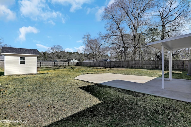 view of yard with a storage unit, central AC, and a patio area