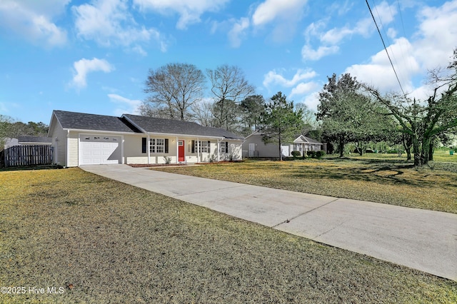 single story home with a garage and a front lawn