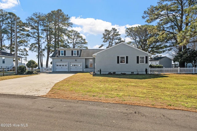 view of front of home featuring a garage and a front yard