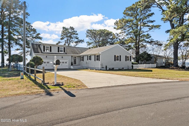 view of front facade with a garage and a front yard