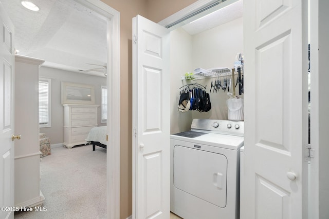 washroom with light colored carpet and washer / clothes dryer